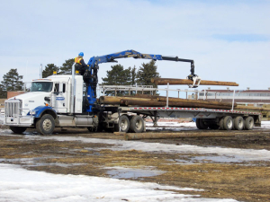 Adams Industries Loading Wood On Truck Trailer