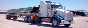Adams Industries semi truck with pipes