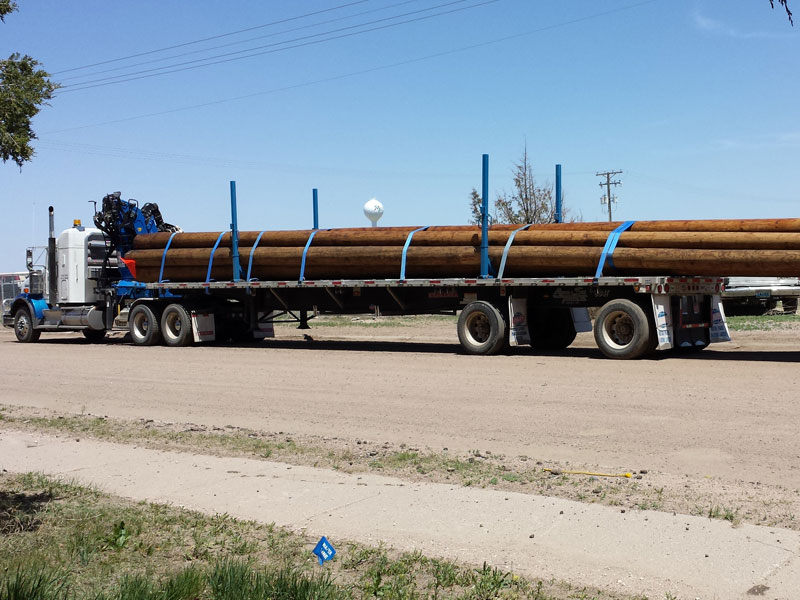 Adams Truck Trailer Hauling Wood Logs